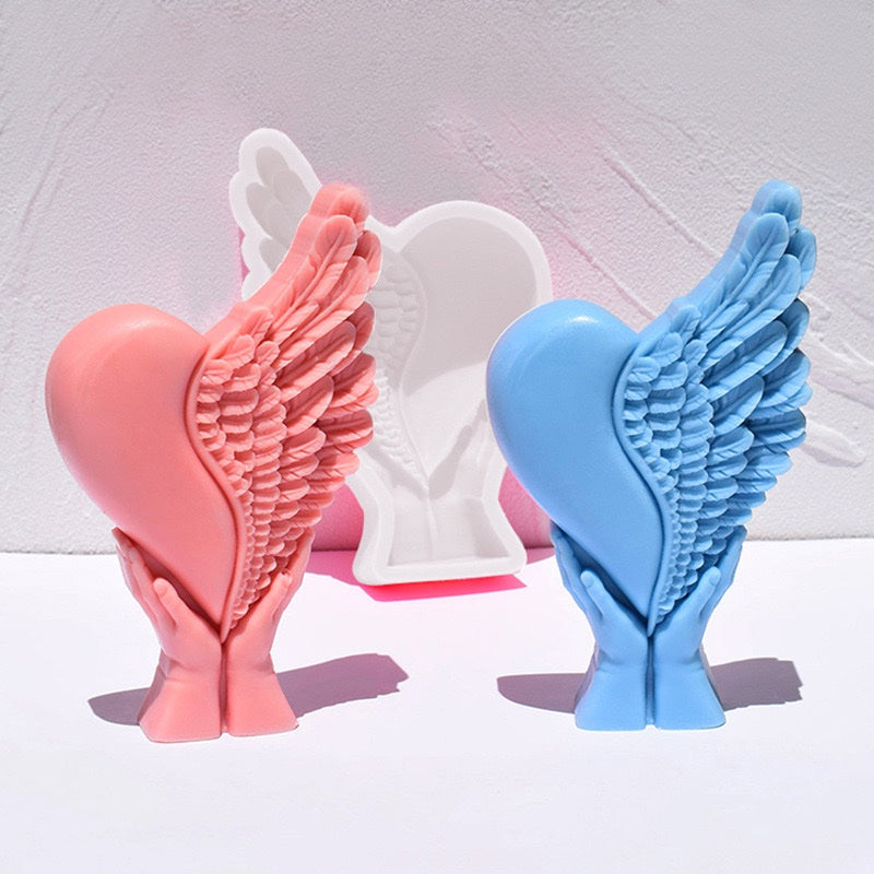 Hand Holding Wings